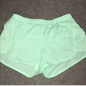 Mint green running shorts
